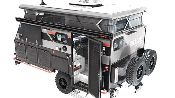 A view of the Black Series HQ14 with the top popped showing the expandability of the camper