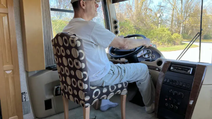 Peter using a dining room chair to demonstrate how funny he is. But don't be fooled, you can't use a dining room chair to replace your RV's captains chair.