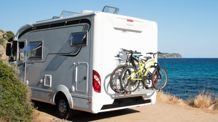 RV carrying two bikes on a rear shelf/rack