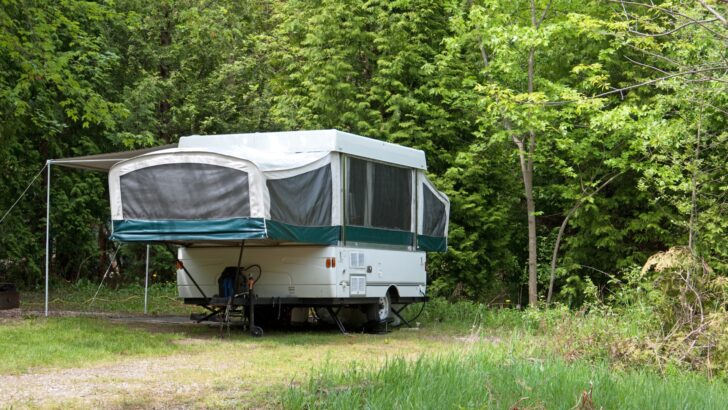 A pop-up camper with the roof and tent ends deployed... a versatile little vehicle that puts a lot of recreation into the RV world.