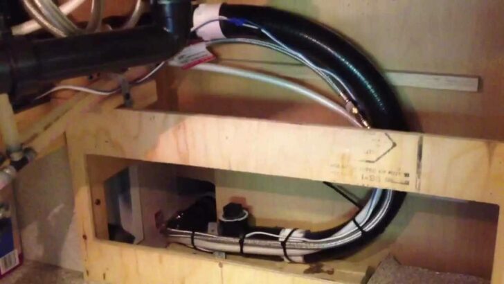 Plumbing components built into a kitchen slide-out