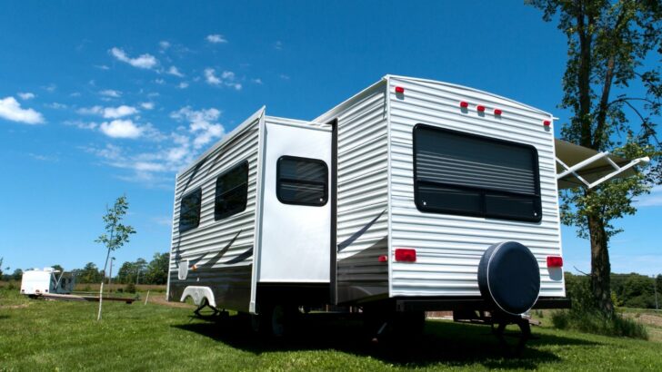 An extended slide-out on a travel trailer, shown from behind the camper.