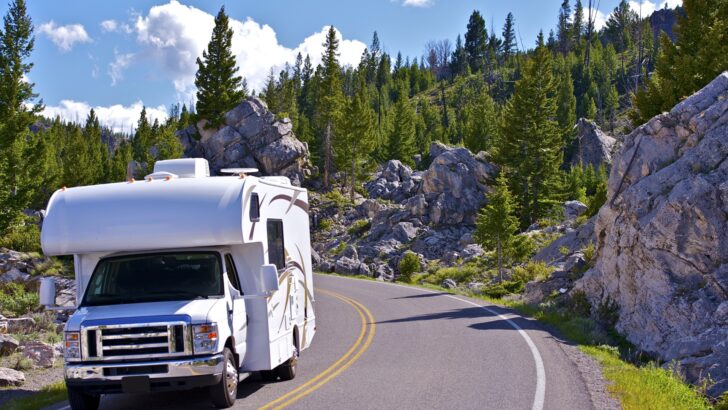 An RV rounding a corner on the road