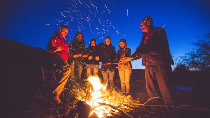 Adults around a campfire