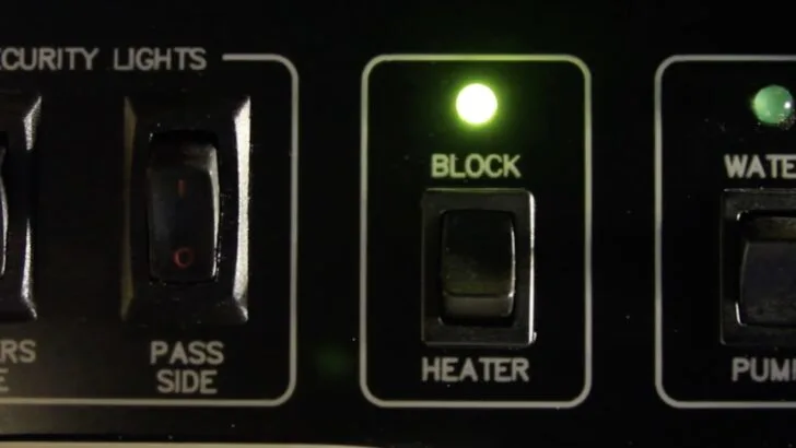 The control panel inside our Newmar Mountain Aire showing the block heater engaged