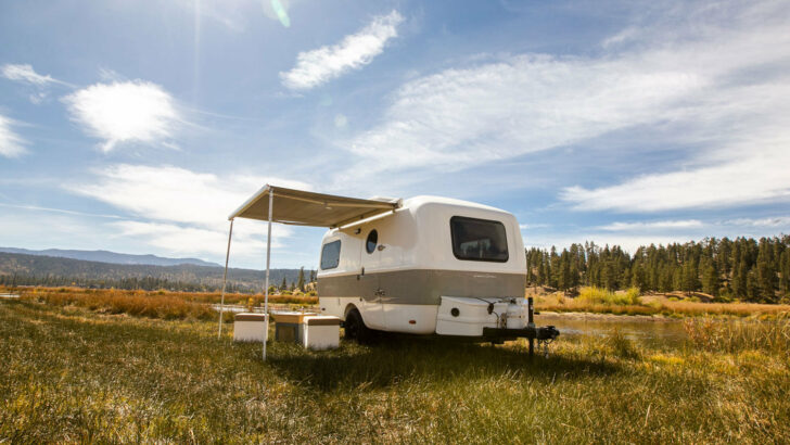 The Traveler shown with awning extended and some Adaptiv cubes outside