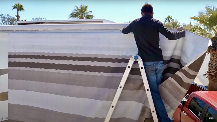 Sliding the awning out during a Dometic Awning Fabric Replacement