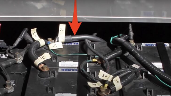 Red arrow showing the main negative cable leading into the RV