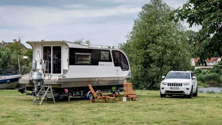 A Caravanboat being used as a camper on land