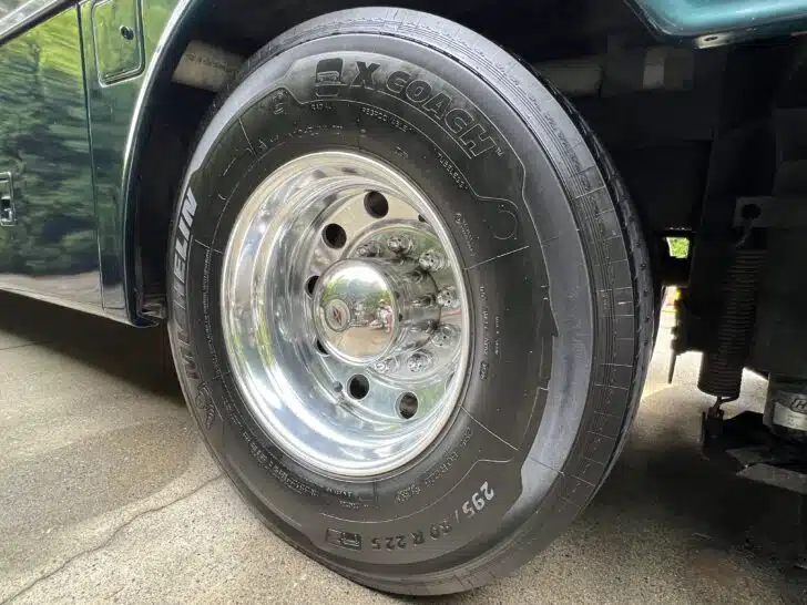 Shiny new motorhome tire, mounted to a shiny motorhome
