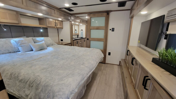 A bedroom of a Luxe Elite luxury 5th wheel camper.