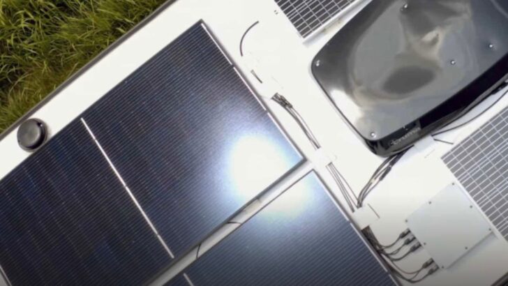 The roof of a Model 1 shown with solar panels and Truma Aventa Eco air conditioner
