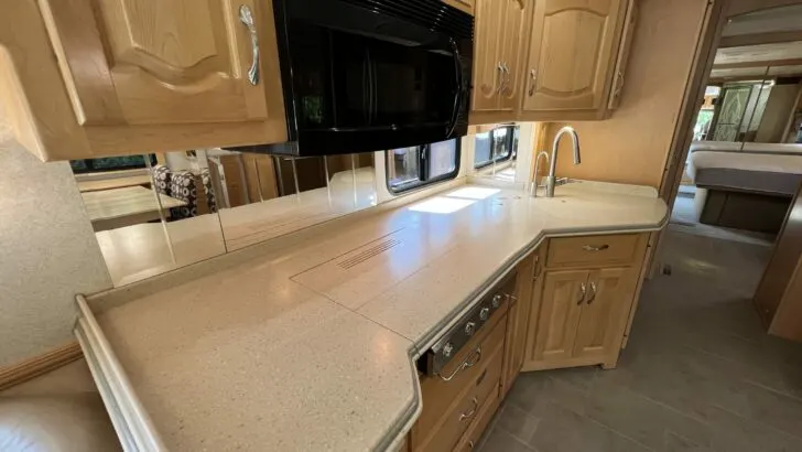 An RV kitchen with a large integrated Corian countertop