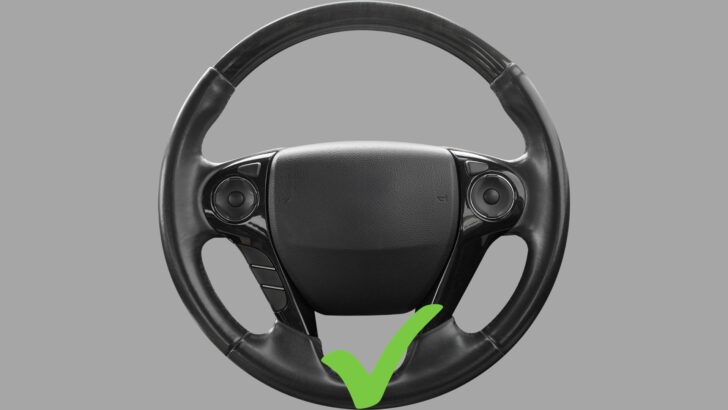 A vehicle steering wheel with the six o'clock position noted