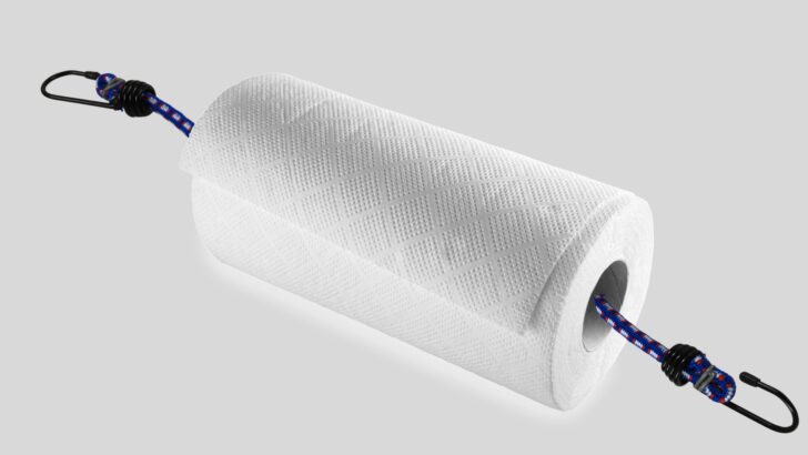 A small bungee cord threaded through the center of a roll of paper towels