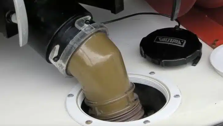 Learning how to clean an RV black tank properly requires a clear sewer elbow to see what's happening.