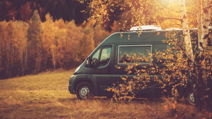 A camper van parked in a field