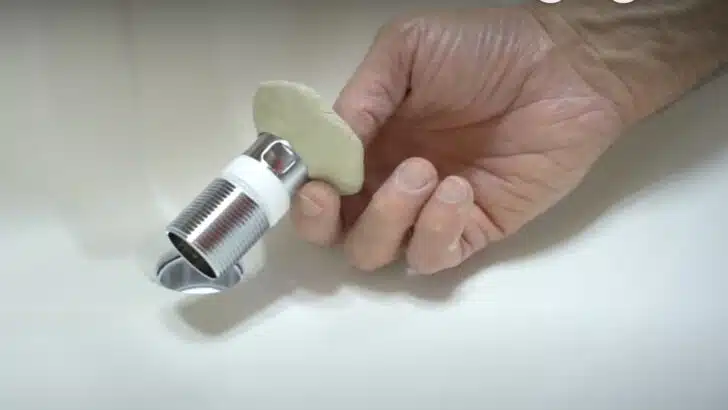 Putty and pipe tape on the new sink drain