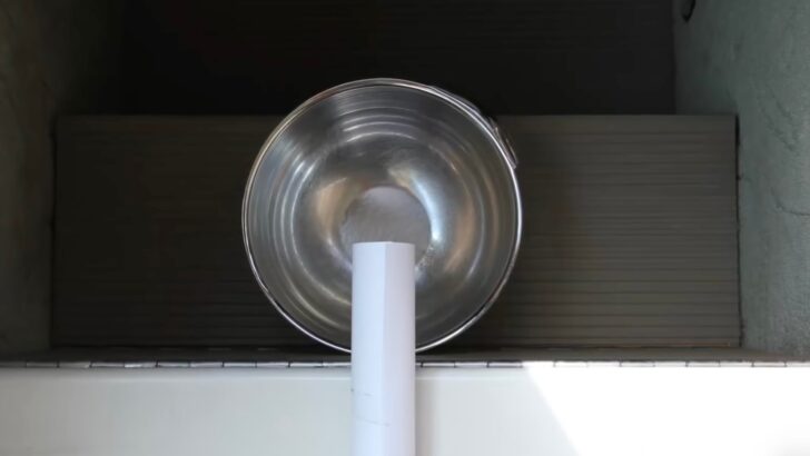 Tube shown positioned with the treat end over the center of the bowl.