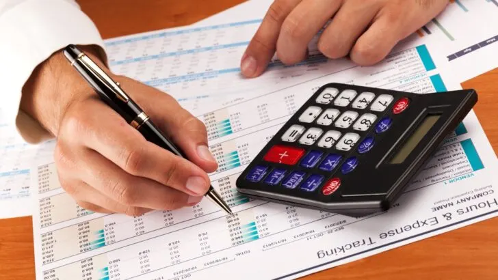 A person calculating expenses