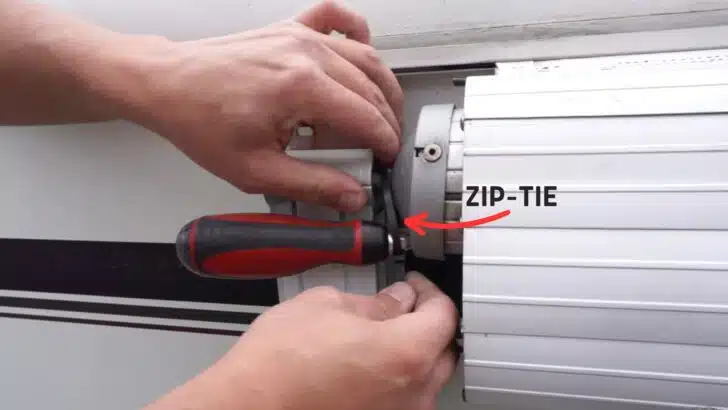 Securing the screwdriver to the arm with a zip-tie